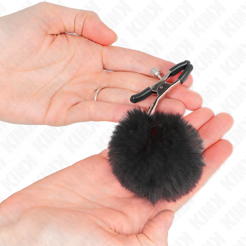 KINK – Pince à tétons avec pompons en fourrure noire